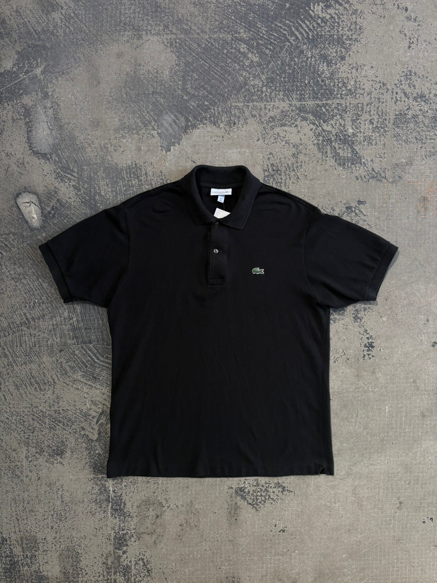 Polo Lacoste nera maniche corte L