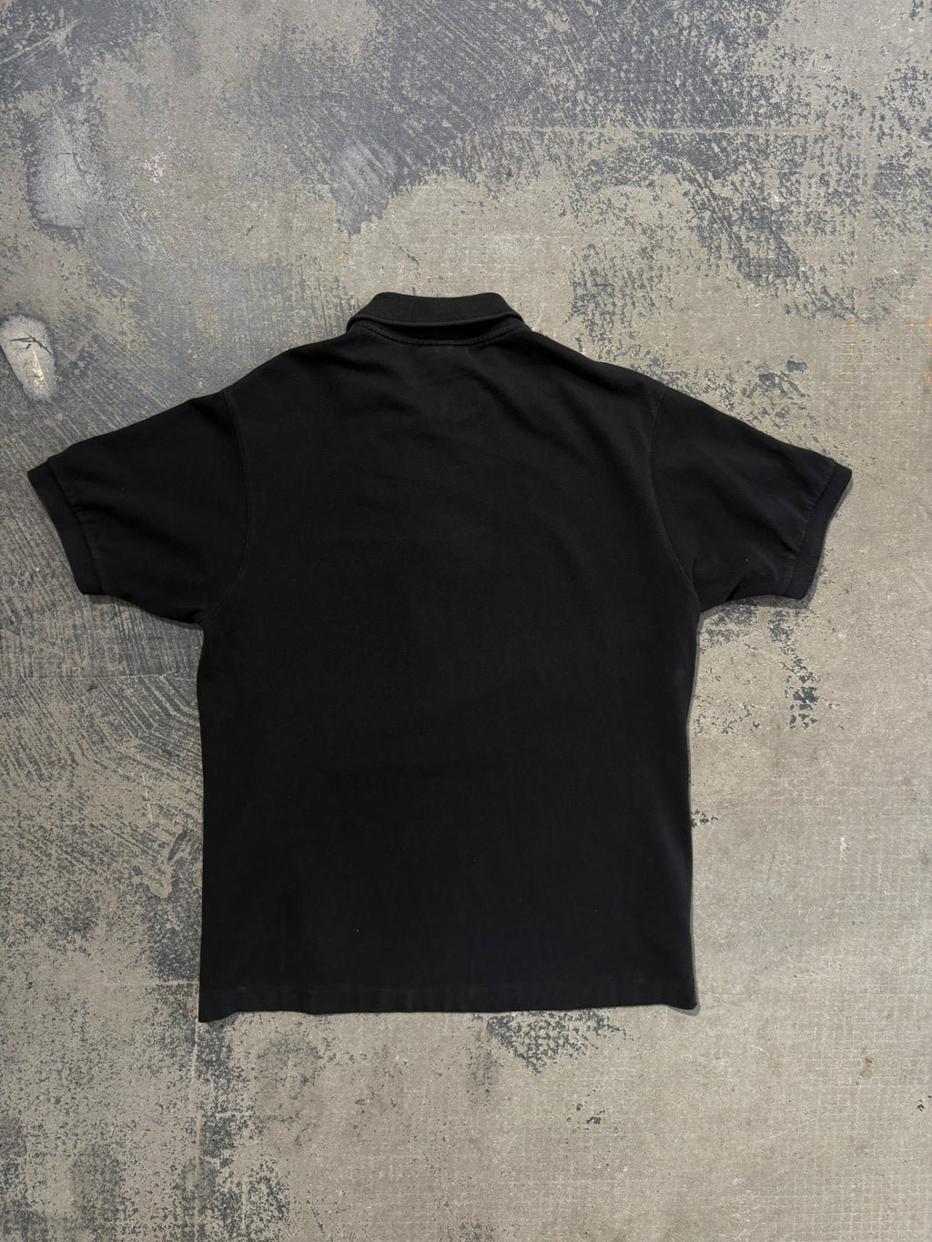 Polo Lacoste nera maniche corte L