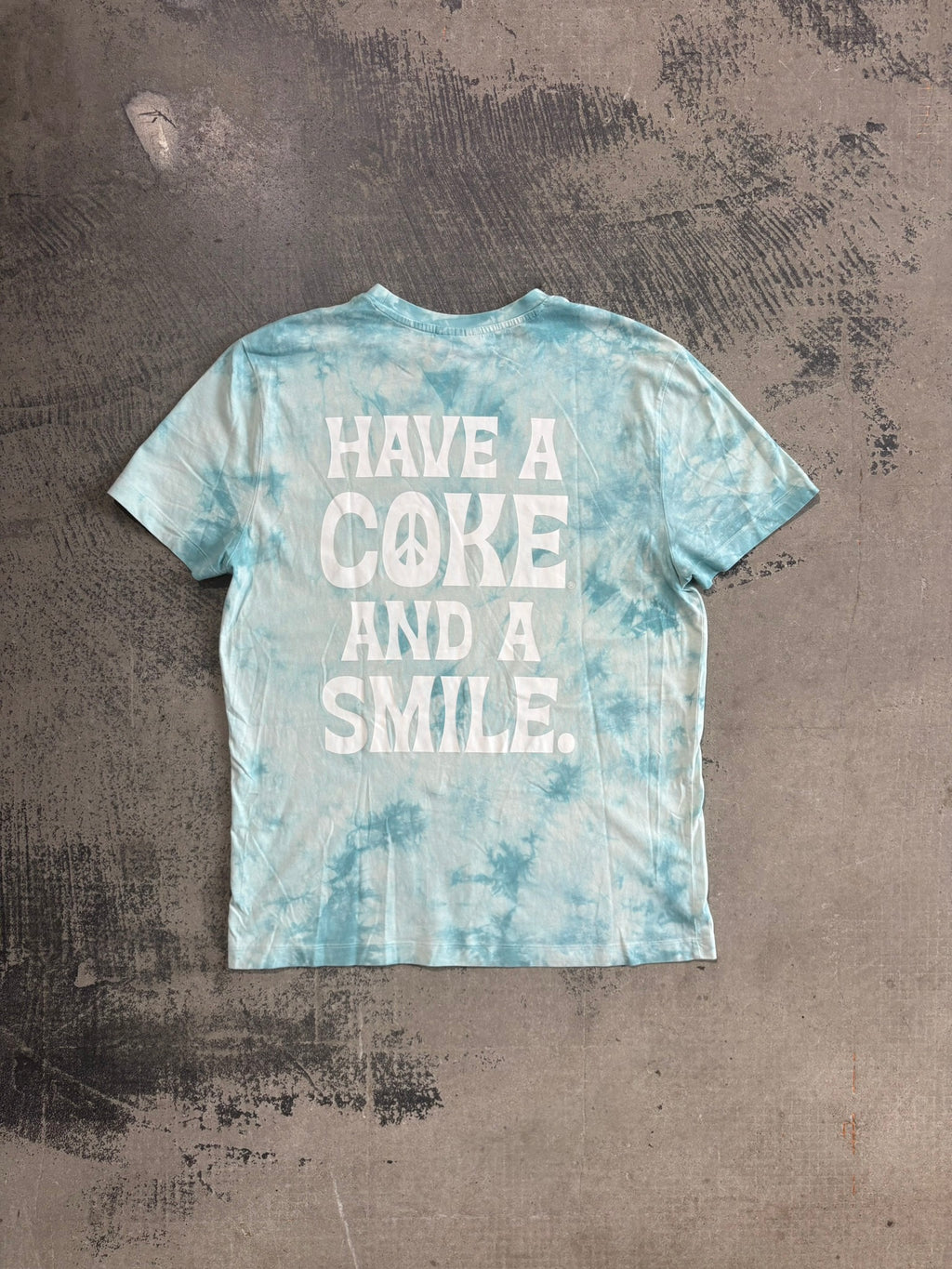 T-Shirt ufficiale Coca-Cola Tie-Dye "Have a Coke and a Smile" azzurro/bianco L